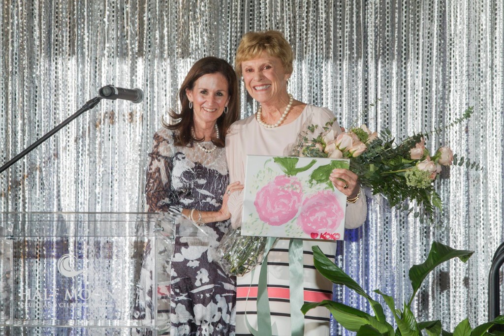 Nancy Wilcox, left, president of the Board of Directors of St. Mary’s Home and a longtime member of St. Mary’s Auxiliary Board, with Mollie Pavlik, president of the Auxiliary Board. Wilcox presented Pavlik with flowers and a painting created by Koko, who lives at St. Mary’s, to thank her for leading the event. (photo courtesy Hampton Roads Photography)