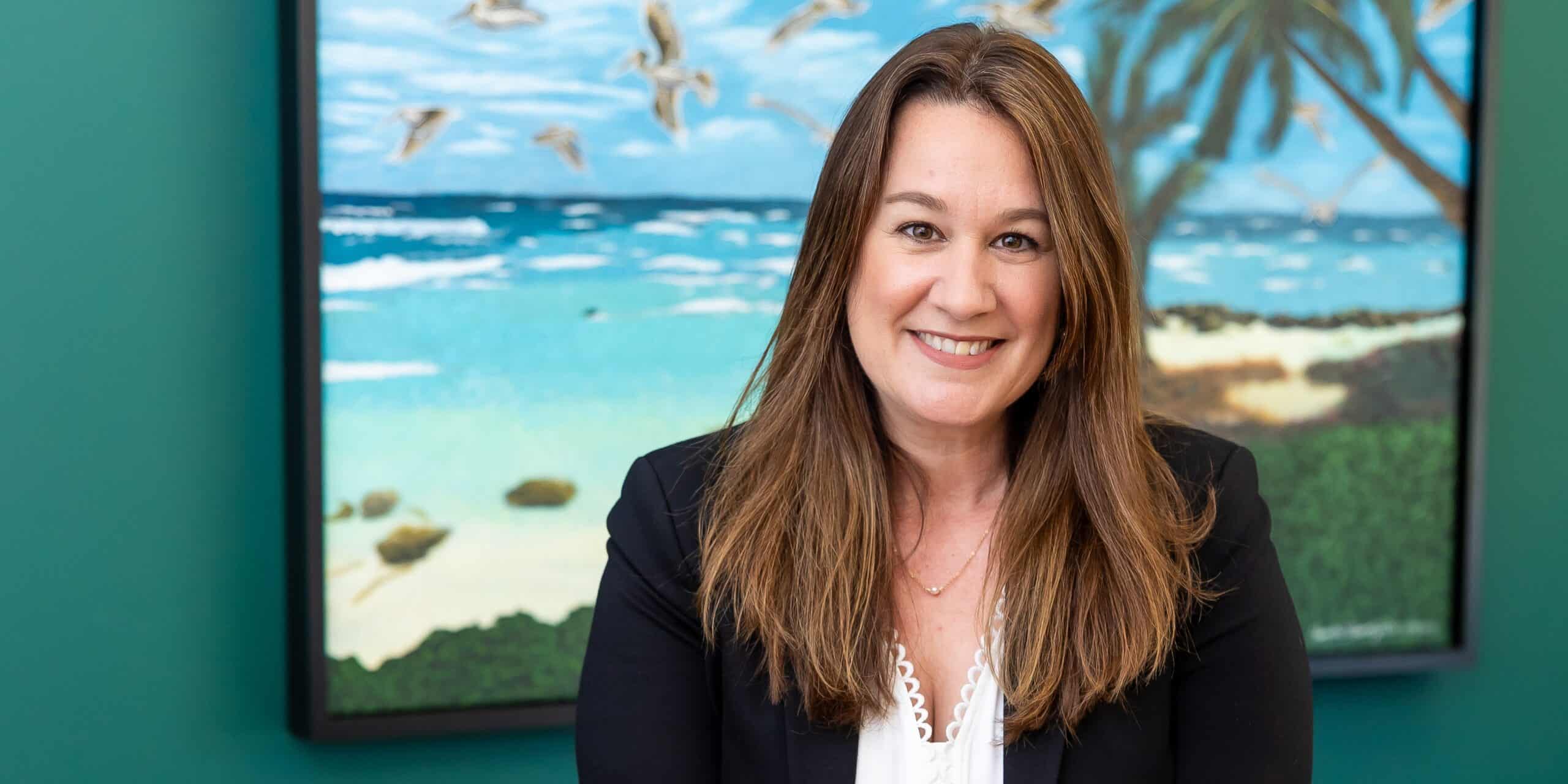 Shannon Edsall standing at desk